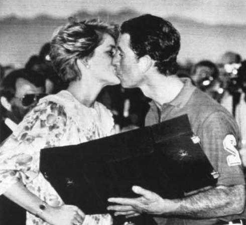 Princess Diana kisses Prince Charles after giving him his runners up prize at a Polo match he played in at the Royal Oman Polo Ground on November 12, 1986. Prince Charles and Princess Diana
