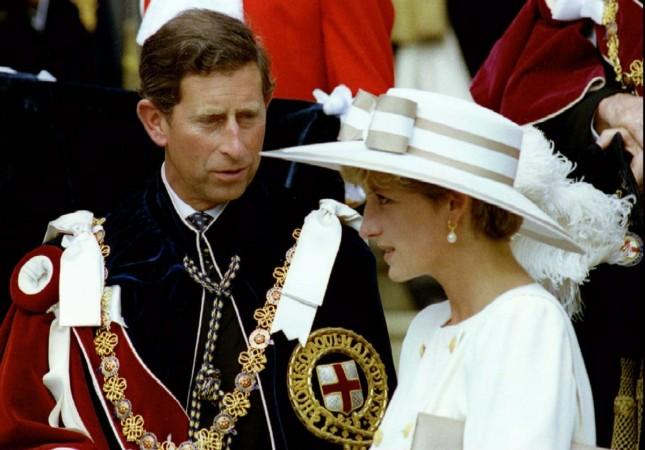 Prince Charles looks towards Princess Diana as they await their carriage to depart the Order of the Garter ceremony at Windsor Castle June 15, 1992. Prince Charles and Princess Diana