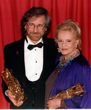 American film director Steven Spielberg accompained by French actress Jeanne Moreau pose with their French Jeanne Moreau