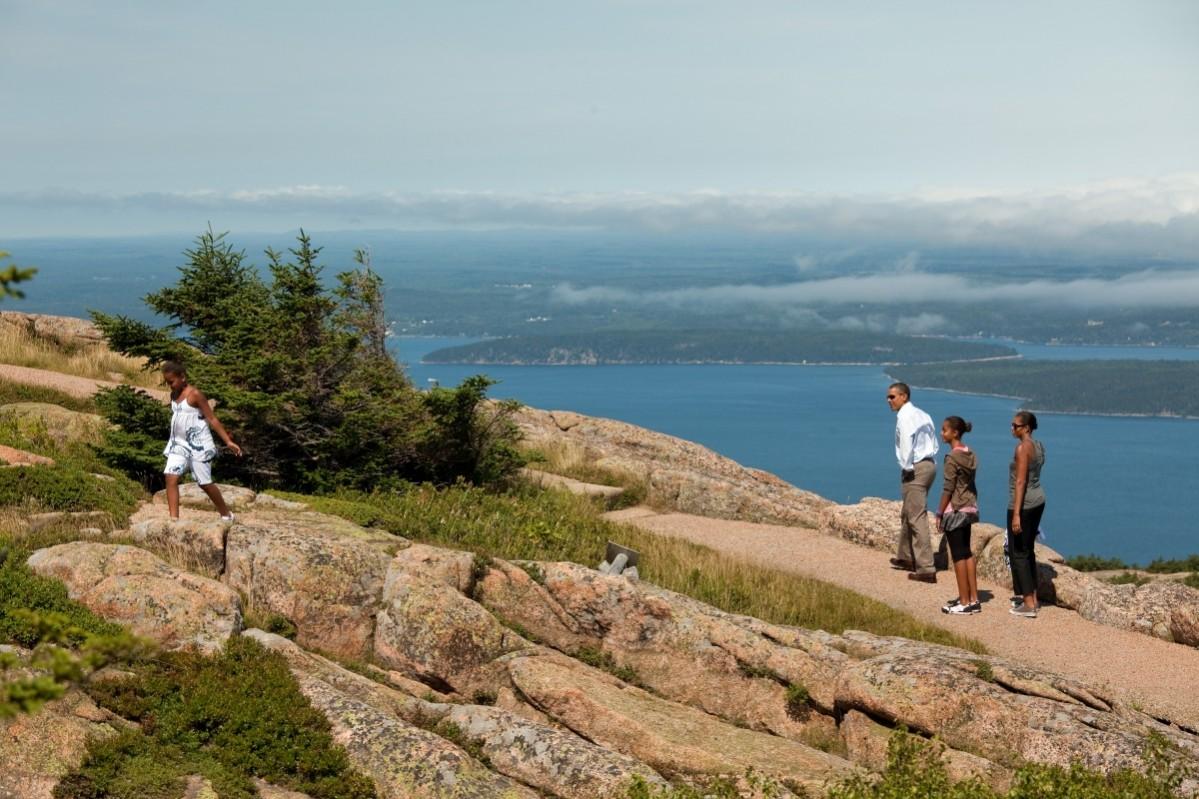 In this image provided by The White House, U.S. President Barack Obama (2L), first lady Michelle Obama (R), and daughters Sasha Obama (L) and Malia Obama hike on Cadillac Mountain July 16, 2010 in Acadia National Park, Maine. Acadia National Park, Maine