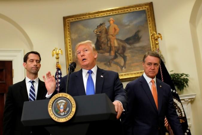 In picture: US President Donald Trump speaks during an announcement on immigration reform accompanied by Senator Tom Cotton (R-AR) (left) and Senator David Perdue (R-GA) (right), in the Roosevelt Room of the White House in Washington on August 2, 2017. US President Donald Trump