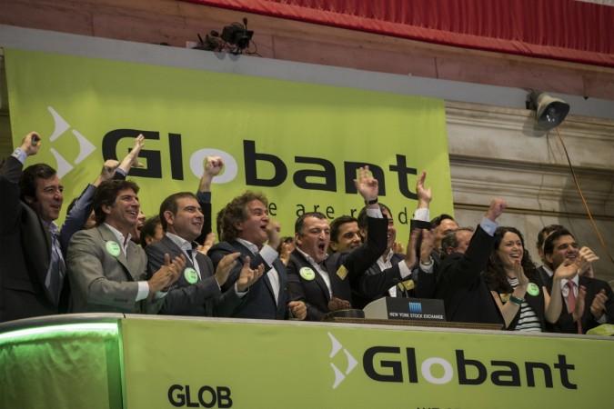 Globant SA, CEO Martin Migoya (C) and company officials ring the opening bell to celebrate the company's IPO at the New York Stock Exchange Globant