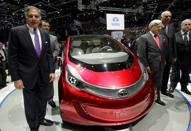 Tata Motors' former chairman Ratan Tata (L) poses in front of the Megapixel model car during the first media day of the Geneva Auto Show at the Palexpo in Geneva, March 6, 2012. Tata Motors at Geneva Motor Show