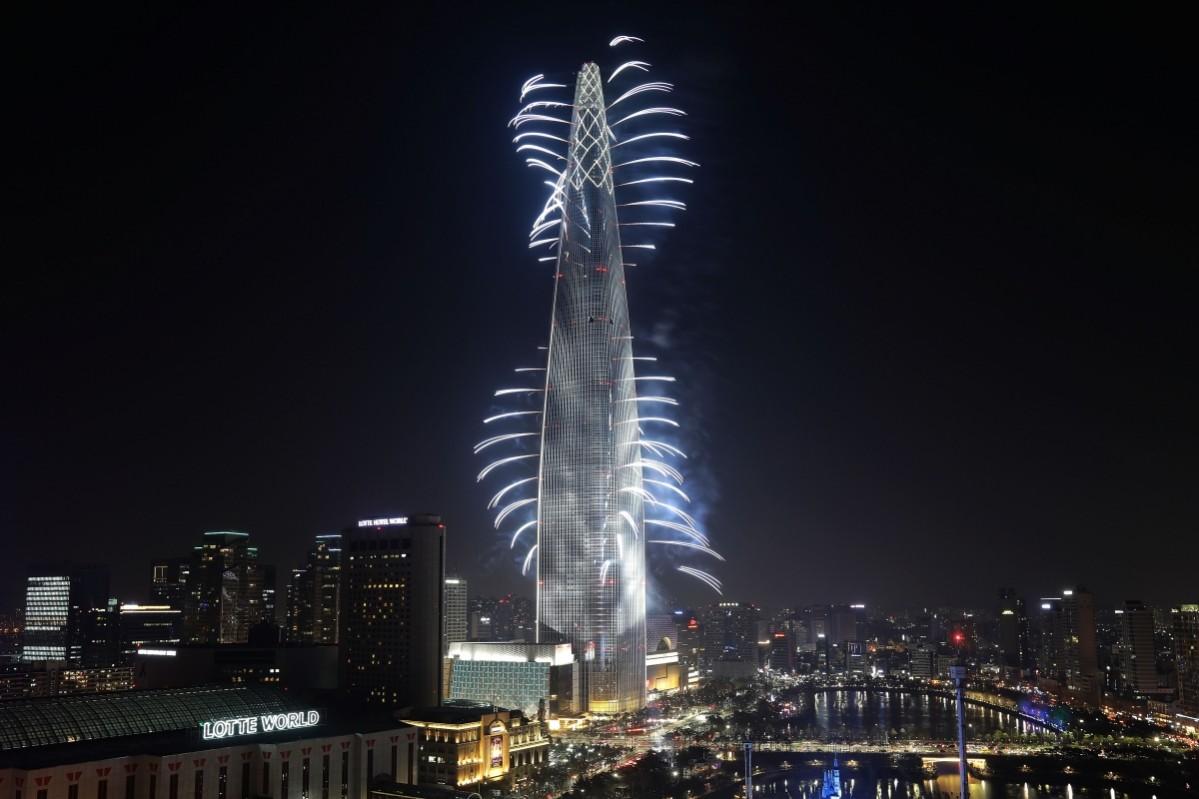 Fireworks illuminate on the Lotte World Tower to commemorate the opening on April 2, 2017, in Seoul, South Korea. Lotte World Tower