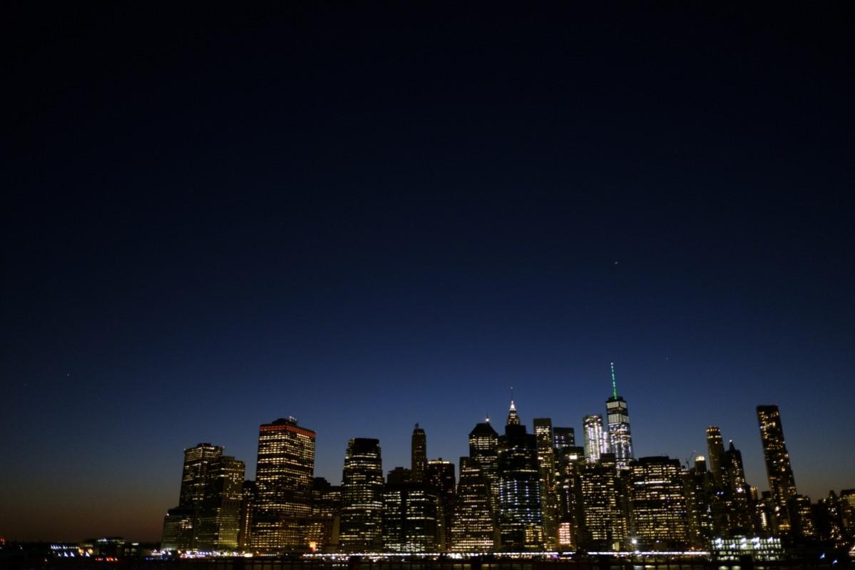 As directed by New York Governor Andrew Cuomo in response to President Donald Trump's decision to pull the United States out of the Paris Climate Accord, One World Trade Center is illuminated with green light, June 1, 2017, in New York City. NYC's One World Trade