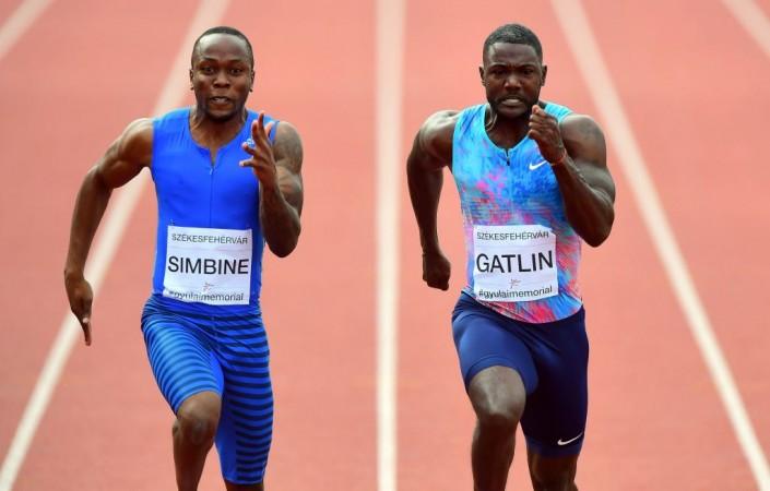 Akani Simbine and Justin Gatlin (R) Akani Simbine