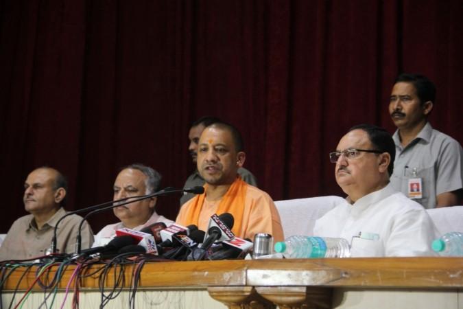 Uttar Pradesh Chief Minister Yogi Adityanath addresses a press conference with Union Health Minister J.P. Nadda in Gorakhpur of Uttar Pradesh on Aug 13, 2017. Yogi Adityanath