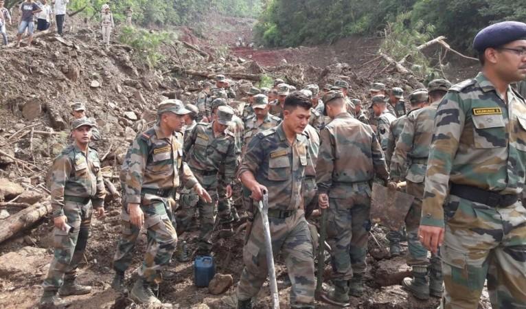In picture: Indian Army personnel aid in search and rescue work after a landslide killed at least 46 people in Himachal Pradesh. Indian Army