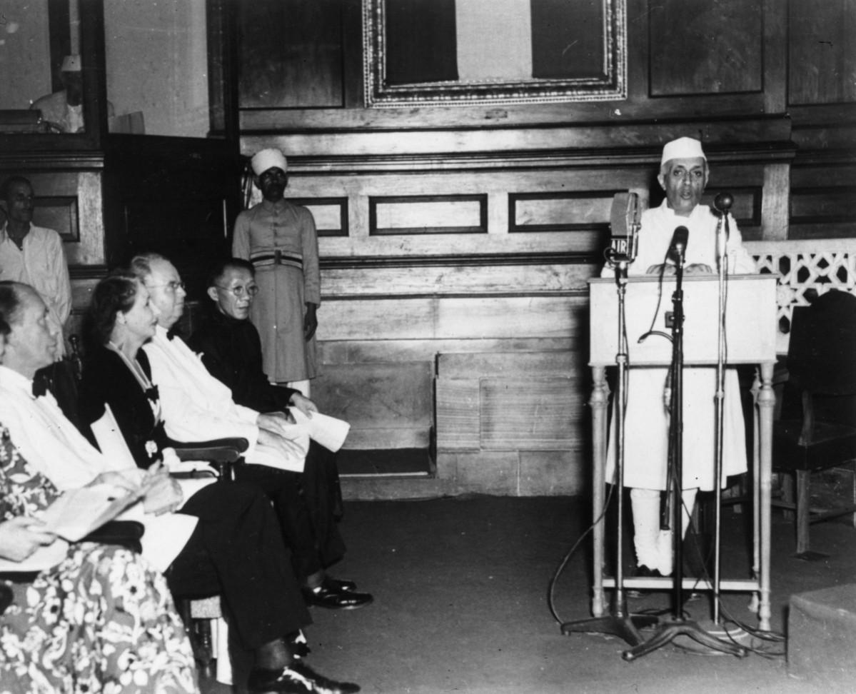 Pandit Jawaharlal Nehru (1869 - 1964) making his speech on the midnight session of the Indian CA when the new self-governing dominion of India was formed. Chinese, American and Dutch diplomats are seated to the left. India's Independence
