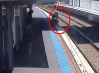 Mum desperately rescues baby as pram rolls on to train tracks
