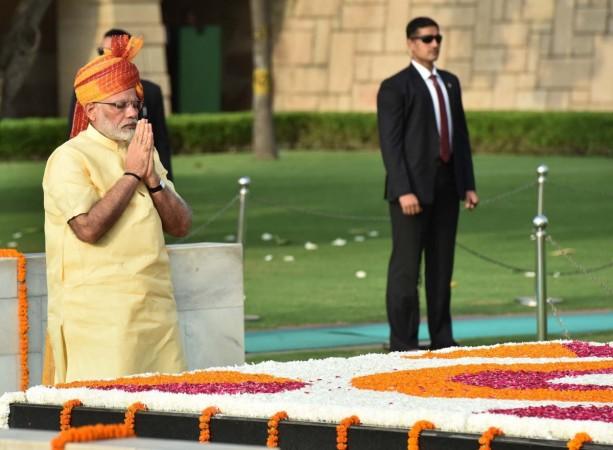 Prime Minister Narendra Modi pays homage at the Samadhi of Mahatma Gandhi, at Rajghat, on the occasion of 71st Independence Day, in Delhi on August 15, 2017. Narendra Modi