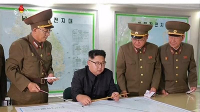 North Korea: Kim Jong-un briefed on plan to fire missiles near Guam North Korea: Kim Jong-un briefed on plan to fire missiles near Guam