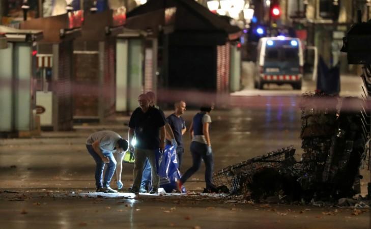 orensic police officers search for clues near the area where a van crashed into pedestrians at Las Ramblas in Barcelona, Spain, August 18, 2017. barcelona terror attack