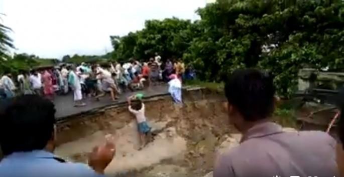 A bridge in Bihar collapses as scores of people looks on A bridge in Bihar collapses as scores of people looks on