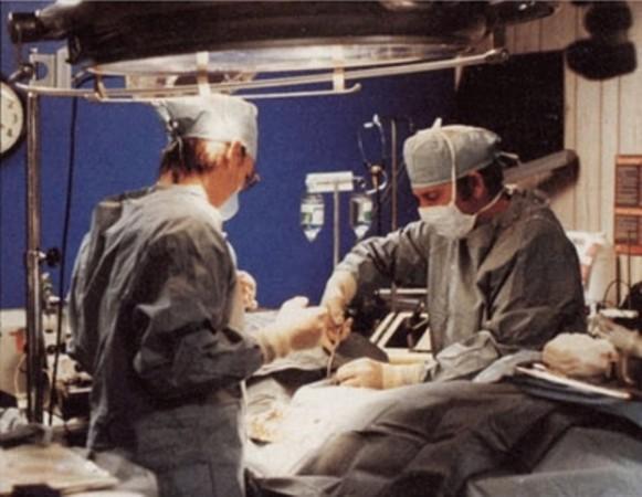 Technicians prepare a body for cryopreservation in 1985. Cryonics