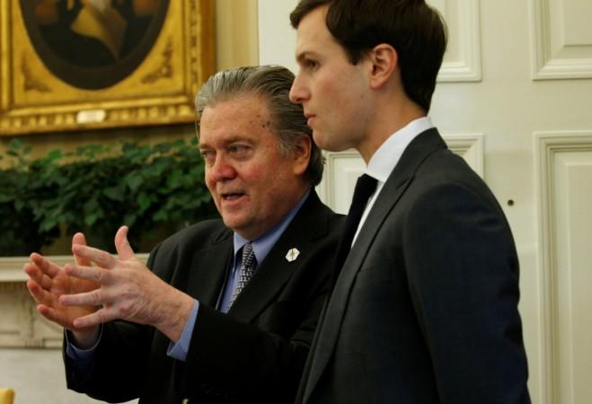 White House chief strategist Steve Bannon (L) and senior advisor Jared Kushner speak after U.S. President Donald Trump signed an executive order at the White House in Washington, U.S. February 3, 2017. Steve Bannon Jared Kushner