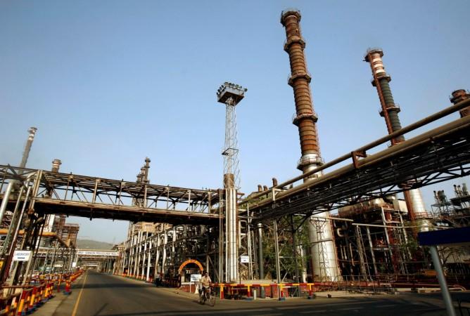 FILE PHOTO: A worker rides a bicycle at the Bharat Petroleum Corporation Ltd. refinery in Mumbai, India April 24, 2008. REUTERS/Punit Paranjpe/File Photo BPCL