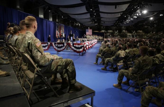 Members of the U.S. military listen as U.S. President Trump announces his new policy for the war in Afghanistan at Fort Meyer, Virginia Trump