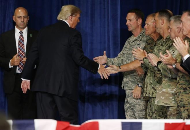 President Trump shakes hands with officers after announcing his new policy for the war in Afghanistan at Fort Meyer, Virginia Trump