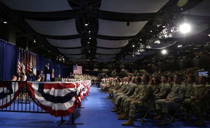 Military members watch as U.S. President Trump announces his new policy for the war in Afghanistan at Fort Meyer, Virginia trump