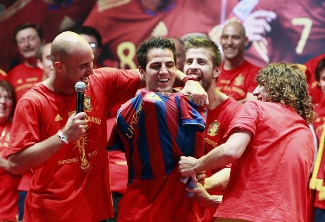 Fabregas' Spain and Barca teammates put on a Barcelona shirt on the Arsenal player during Euro 2010 victory celebrations, July 12, 2010 Fabregas, Reina, Pique, Puyol, Barcelona, Spain
