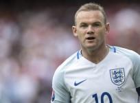England captain Wayne Rooney retires from international duty
