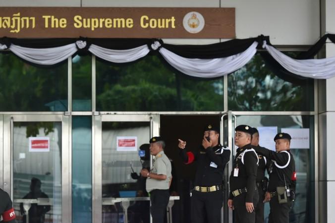 In picture: Policemen stand in front of the Supreme Court of Thailand, in Bangkok, capital of Thailand, on Aug. 25, 2017. The Supreme Court of Thailand on Friday postponed the verdict in former Prime Minister Yingluck Shinawatra's rice pledging case to Sept. 27 as she failed to show up at the court, and the court issued an arrest warrant against her. Thailand Supreme Court