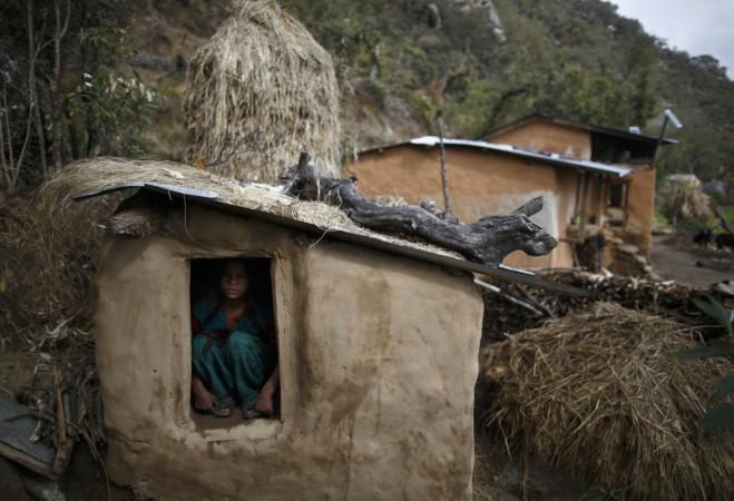 A 14-year-old sits inside a Chaupadi shed in the hills in western Nepal Nepal