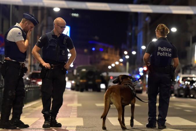 Policemen react on the scene after Belgian soldiers shot a man who attacked them with a knife, in Brussels, Belgium August 25, 2017. Brussels attack