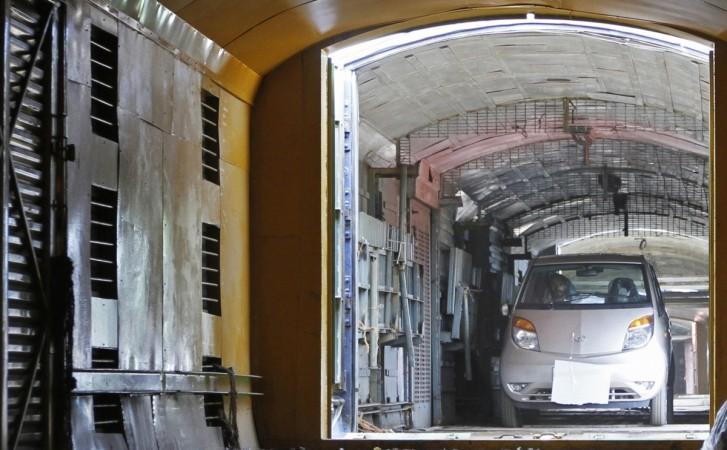 A Tata Motors Nano car is loaded onto a goods train for shipment at Sanand railway station in Gujarat on September 1, 2011. REUTERS/Amit Dave Tata Nano