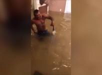 Man tries to catch fish with bare hands in flooded Texas home