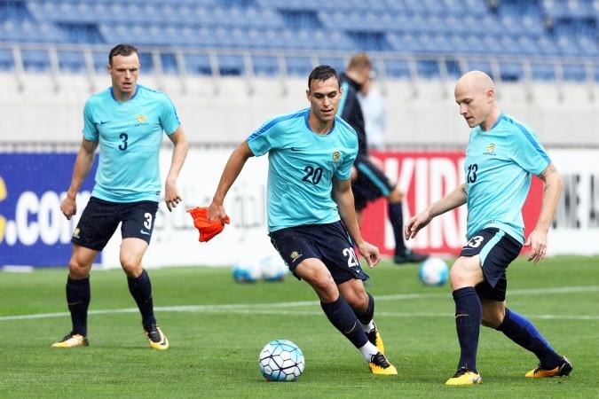 Aaron Mooy (R) trains with the Australia football team australia football