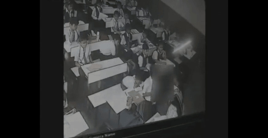 Screengrab of CCTV footage. teacher slaps student