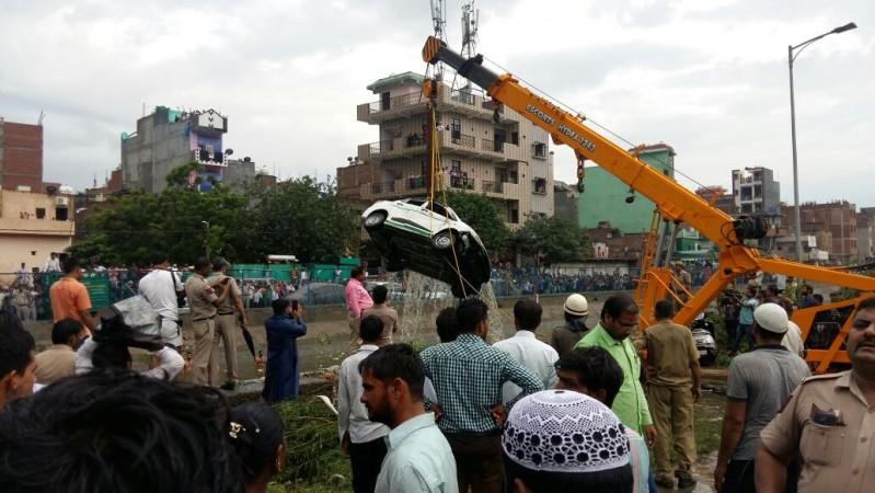 In picture: Authorities fish out a car that had been trapped when a landfill had collapsed in the Ghazipur area of Delhi on Friday, September 1, 2017. Ghazipur landfill collapse