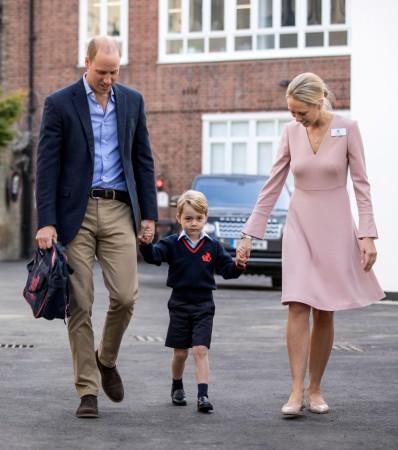 Helen Haslem, head of the lower school and Britain's Prince William hold Prince George's hands as he arrives for his first day of school at Thomas's school in Battersea, London Helen Haslem, head of the lower school and Britain's Prince William hold Prince George's hands as he arrives for his first day of school at Thomas's school in Battersea, London