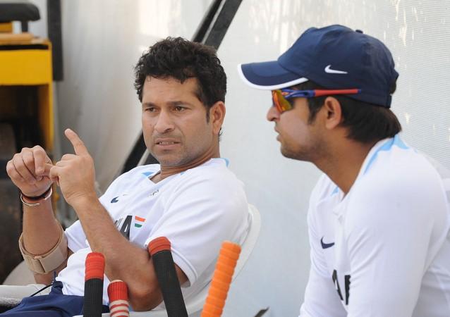 File photo of Sachin Tendulkar and Suresh Raina Suresh Raina & Sachin Tendulkar