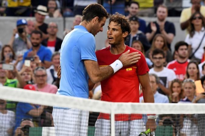 Spain's Rafael Nadal (R) congratulates Argentina's Juan Martin Del Potro on winning their men's singles semi-final tennis match at the Olympic Tennis Centre of the Rio 2016 Olympic Games in Rio de Janeiro on August 13, 2016 nadal, del potro, tennis