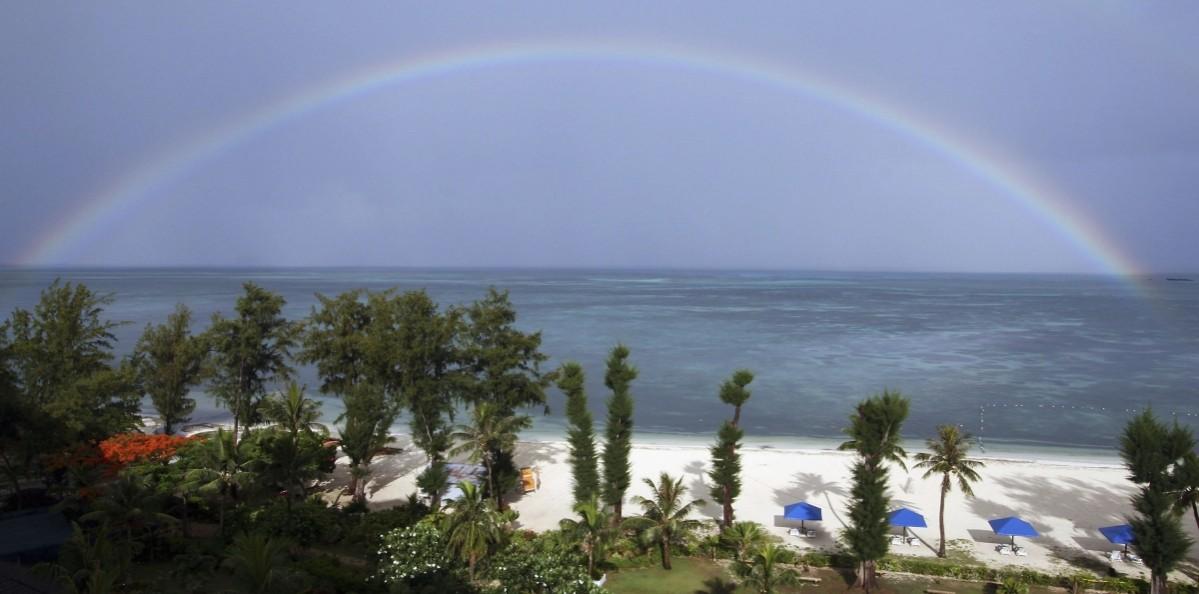 A rainbow over the sea is seen during Emperor Akihito and Empress Michiko's visit to their island on June 27, 2005 in Saipan, Northern Mariana Islands. Northern Mariana Islands