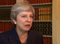 UK PM Theresa May defends response to Hurricane Irma