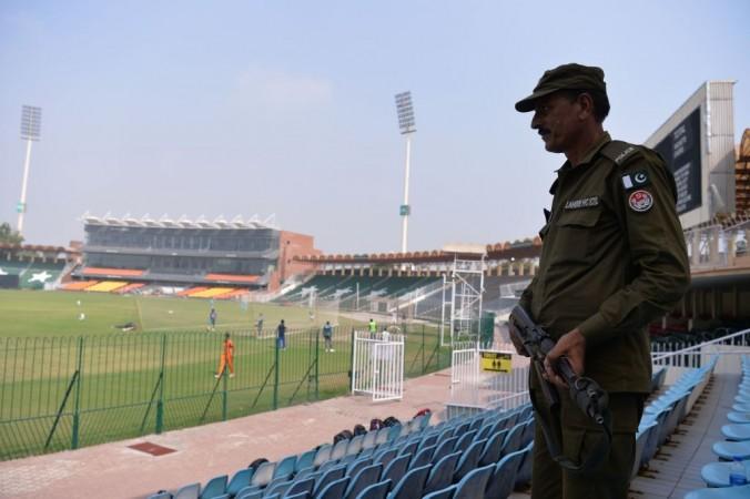 A Pakistani policeman stands guard while the national team trains for the upcoming T20I matches Gadaffi Stadium security