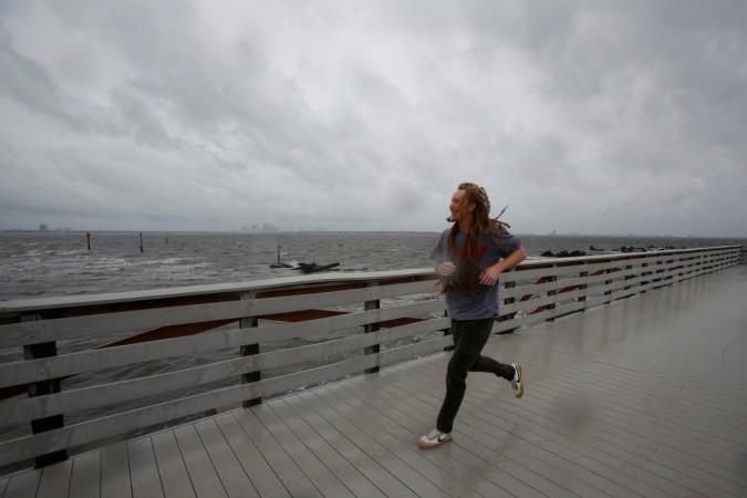 In picture: A man runs on the pier at Ballast Point Park ahead of the arrival of Hurricane Irma in Tampa, Florida, US, September 10, 2017. Hurricane Irma
