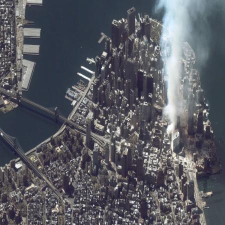A satellite image captured on September 12, 2001, shows an area of white dust and smoke at the location where the World Trade Center towers once stood in New York City. Terrorists flew two hijacked airliners into the twin towers on September 11, killing over 3,000 people. World Trade Center attack