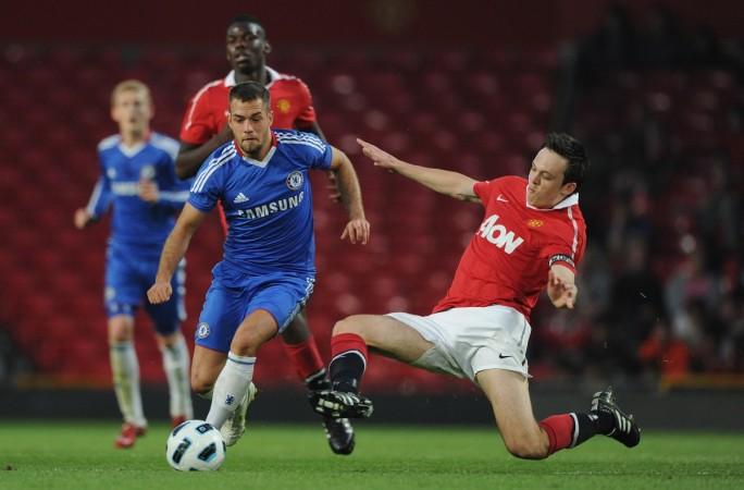 Milan Lalkovic of Chelsea is tackled by Tom Thorpe of Manchester United during the FA Youth Cup Semi Final 2nd Leg between Manchester United and Chelsea at Old Trafford on April 20, 2011 in Manchester, England. tom thorpe