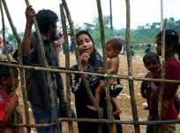 A new Rohingya refugee woman cries as they arrive near the Kutupalang makeshift Refugee Camp, in Cox's Bazar, Bangladesh.
