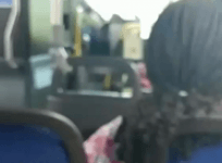 Maryland bus driver reads newspaper while at the wheel