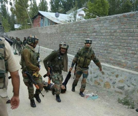 Soldiers dragging away the bodies of the militants shot dead in Nowgam on Thursday. Abu Ismail