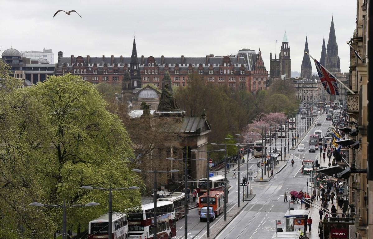 Traffic and pedestrians make their way down Princes Street in Edinburgh, Scotland May 1, 2014. Edinburgh