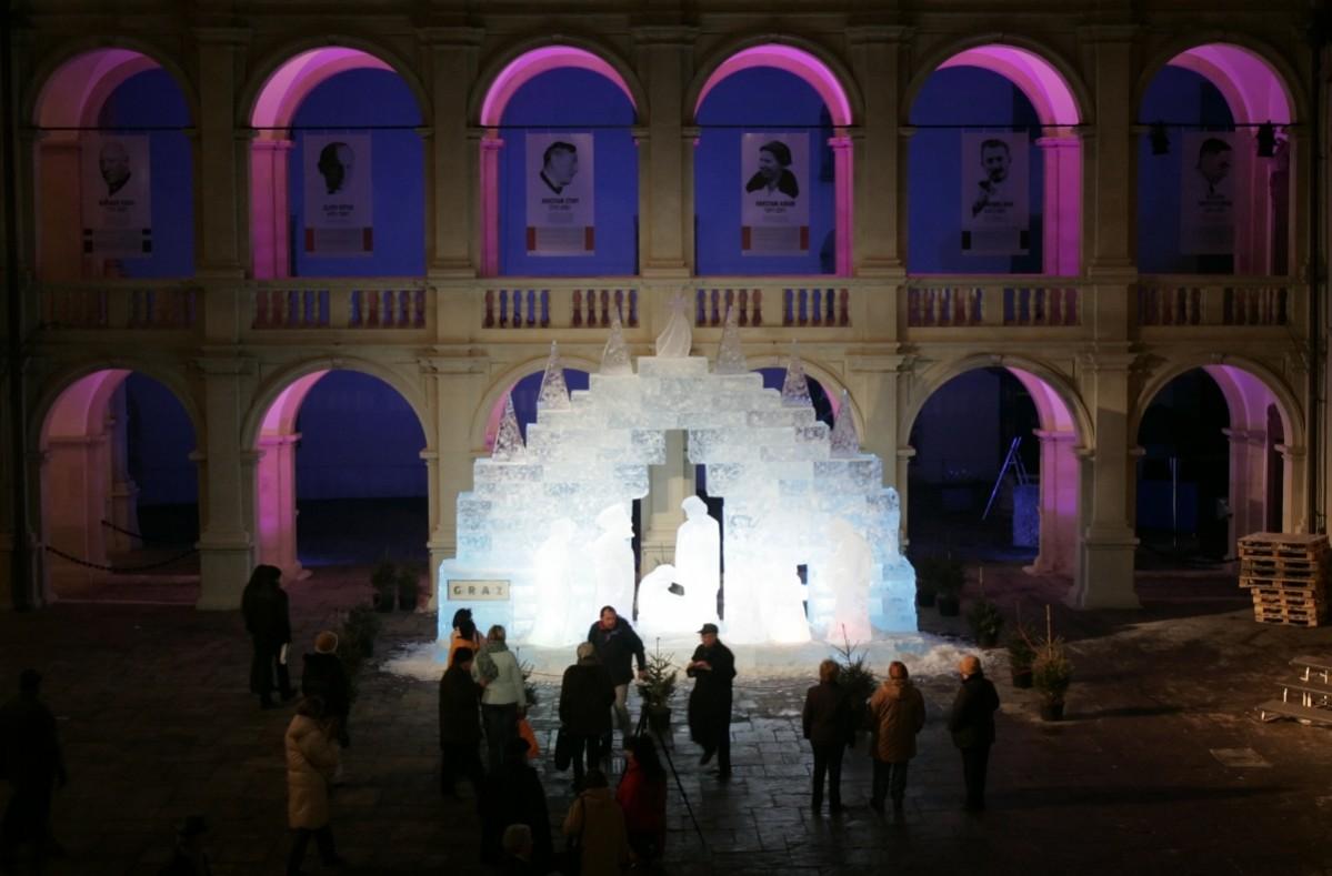Passersby look at a nativity set carved out of 46 tons of ice in Landhaushof in Graz late November 28, 2008. Graz