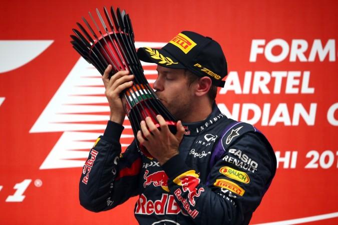 2013 Formula One World Champion Sebastian Vettel of Germany and Infiniti Red Bull Racing celebrates on the podium following the Indian Formula One Grand Prix at Buddh International Circuit on October 27, 2013 in Noida, India sebastian vettel, f1