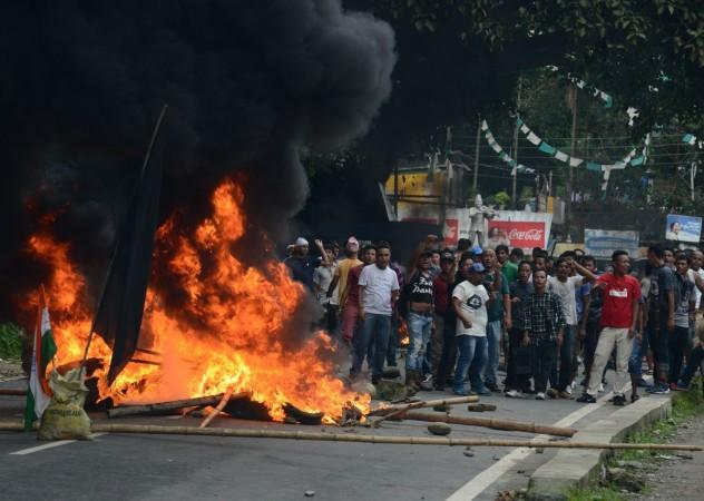 supporters of a separate Gorkhaland state stand by a blazing road block during clashes with police in Sukna village in Darjeeling district Darjeeling